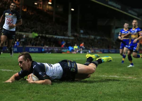 North Queensland Cowboys' Michael Morgan dives in to score his side's first try.