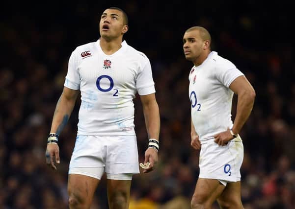 RECALL: Centre Luther Burrell, left.