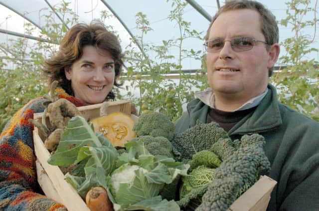 Jonnie and Fanny Watson of Organic Pantry Farm Shop  at Newton Kyme near Tadcaster with a box of organic vegetables  they deliver door to door.