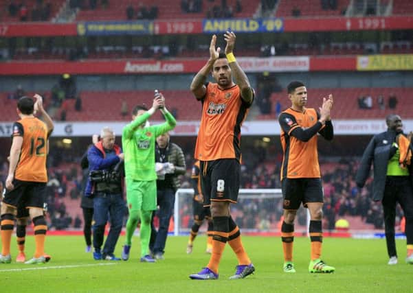 Hull City's Tom Huddlestone and team-mates applaud the travelling fans after their 0-0 draw against Arsenal in the FA Cup fifth round at The Emirates. Picture: PA.