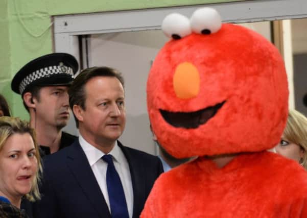 David Cameron confronts 'Elmo' at the election count in his Witney constituency last year