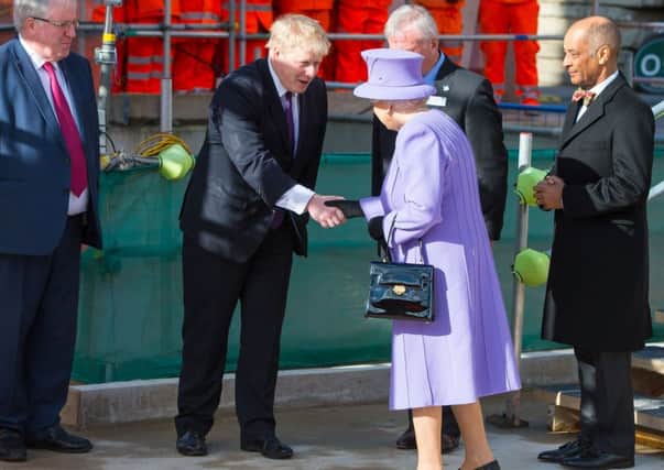 Queen Elizabeth II meets Mayor of London Boris Johnson (centre) and Transport Secretary Patrick McLoughlin (left)