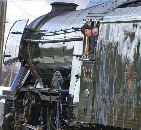The Flying Scotsman, painted in its traditional colours, passes through York for a run to Scarborough ahead of its inaugural journey from Kings Cross to York later this week.
