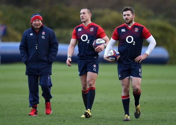 England coach Eddie Jones, left, Mike Brown, centre, and Elliot Daly during a training session at Pennyhill Park, Bagshot yesterday.