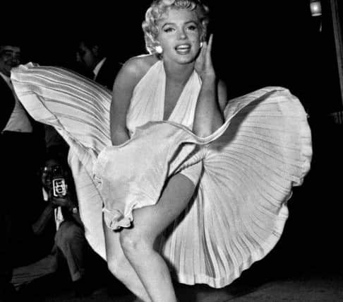 Marilyn Monroe poses over the updraft of a New York subway grating while in character for the filming of "The Seven Year Itch" in Manhattan.