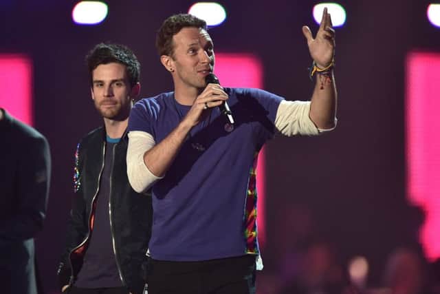 Chris Martin on stage during the 2016 Brit Awards at the O2 Arena, London.   Pic: Dominic Lipinski/PA Wire