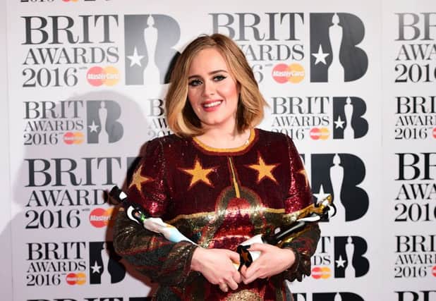 Adele with the BRIT Awards for Best British Female, Best British Album, Best British Single and Global Success Award in the press room at the 2016 Brit Awards at the O2 Arena, London.