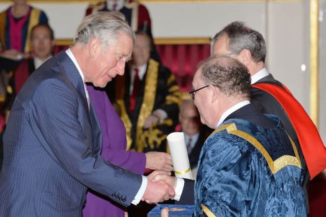 The Prince of Wales with Professor Calie Pistorius of the University of Hull, during the presentation of The Queen's Anniversary Prizes for higher and further education, at a ceremony in Buckingham Palace, London.  Pic: John Stillwell/PA Wire