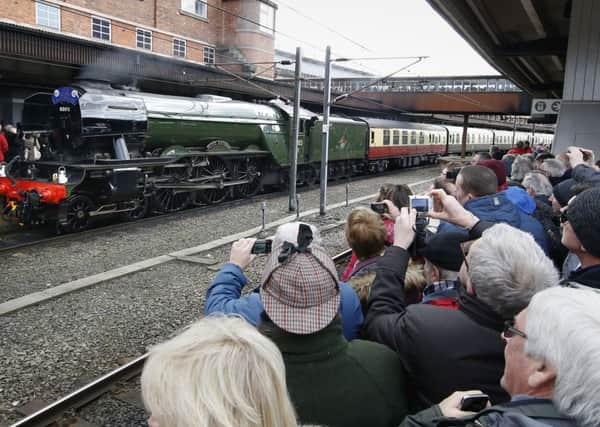 Flying Scotsman arrives at York station after its inaugural run from London after a decade-long, Â£4.2 million refit. (Owen Humphreys/PA Wire).