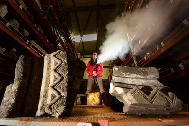 Rachael Bowers, Collections Documentation Assistant at English Heritage, uses a specialist steam cleaner to gently clean the voussior which is due to go into the new museum at Rievaulx Abbey. Picture: Anthony Chappell-Ross