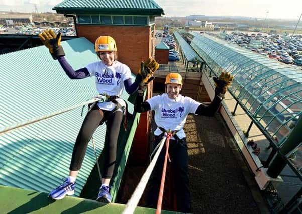 Meadowhall centre director Darren Pearce and Claire Rintoul, Bluebell Wood chief executive, during the abseil.