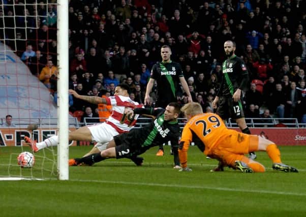 Nathan Tyson scores for Doncaster Rovers against Stoke in the FA Cup prior to suffering an injury (Picture: James Hardisty).