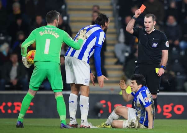 Sheffield Wednesday's Fernando Forestieri (floor) is sent off by referee Tim Robinson.