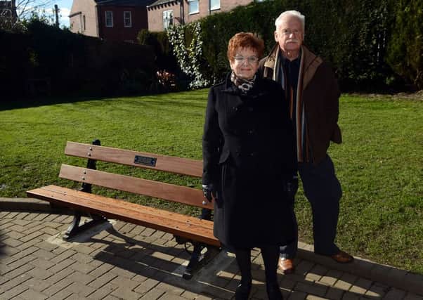 Coun Janet Holmes and local businessman Ian Mosedale by the bench.