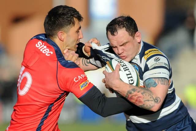 Yorkshire Carnegie's Phil Nilson runs into Gavin Henson, who was on form with the boot for Bristol at Headingley on Sunday. Picture: Steve Riding.