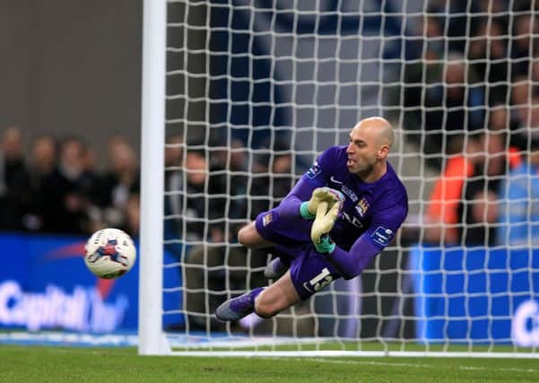 Manchester City goalkeeper Willy Caballero saves a penalty from Liverpool's Philippe Coutinho.