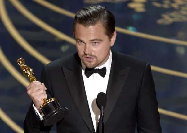 Leonardo DiCaprio accepts the award for best actor. Pictures: Chris Pizzello/Invision/AP