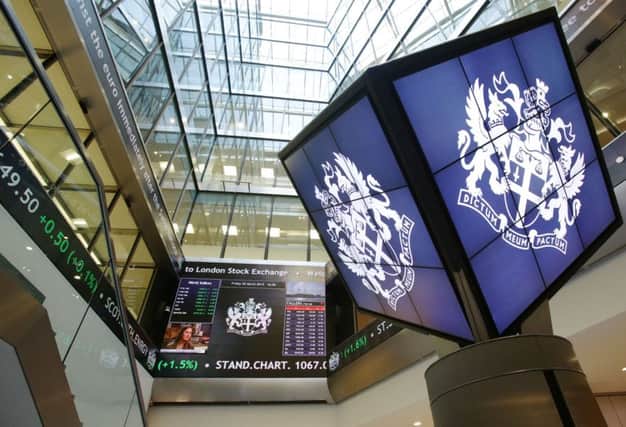 An information screen displaying the FTSE 100 at the London Stock Exchange Photo: Yui Mok/PA Wire