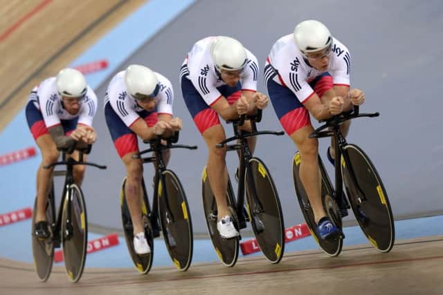 Great Britain's Steven Burke (right) leads the the team in the Men's Team Pursuit Qualification during day one of the UCI Track Cycling World Championships at Lee Valley VeloPark, London.