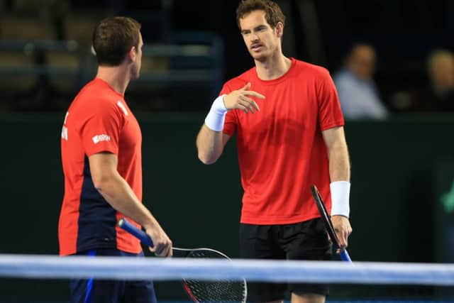 Davis Cup captain Leon Smith chats with Andy Murray, right, during the GB training session in Birmingham on Wednesday. Picture: Mike Egerton/PA.