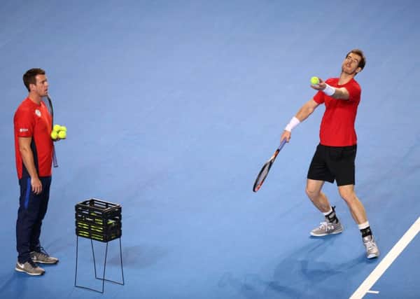 Davis Cup captain Leon Smith, left, watches over Andy Murray. Picture: Mike Egerton/PA.