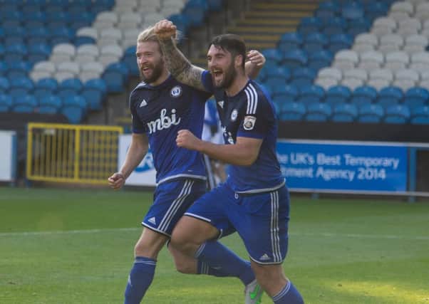 Matty Brown, right, scored the decisive spot-kick to send FC Halifax Town through to the FA Trophy semi-finals. Picture: Bruce Fitzgerald.
