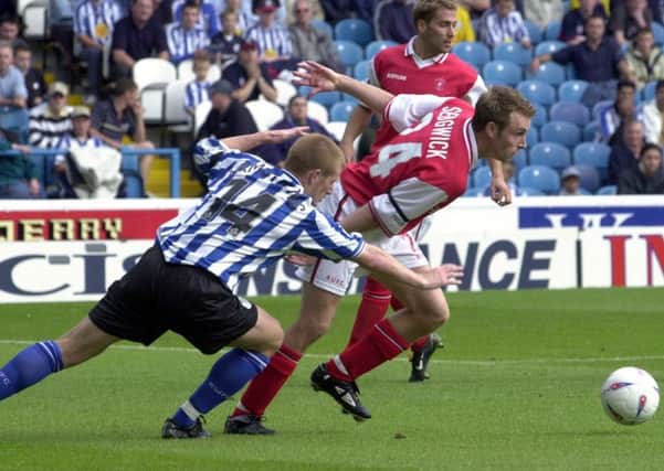 It's August, 2002 and Rotherham's Chris Sedgwick beats Wednesday's  Craig Armstrong to the ball.