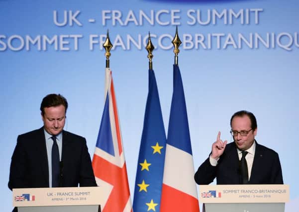 Prime Minister David Cameron (left) and French President Francois Hollande hold a joint press conference during an Anglo-French Summit hosted by President Hollande in Amiens, France.