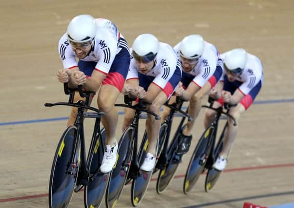Great Britain's Jonathan Dibben (left) leads the team in the Final of the Men's Team Pursuit.