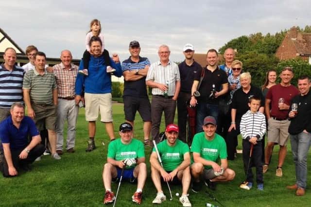 Chris Wilson, Joe Palmer and Leigh Gawley pictured with supporters during their 100-holes-in-a-day marathon last summer at Hornsea GC.