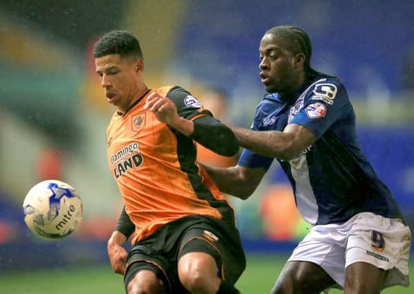 Hull City's Curtis Davies, left, battles against Birmingham City's Clayton Donaldson during Thursday night's 1-0 defeat at St Andrews. Picture: PA.