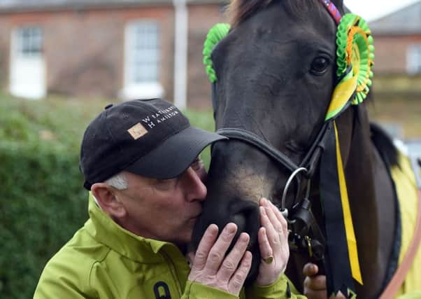 Trainer Oliver Sherwood poses with Many Clouds.