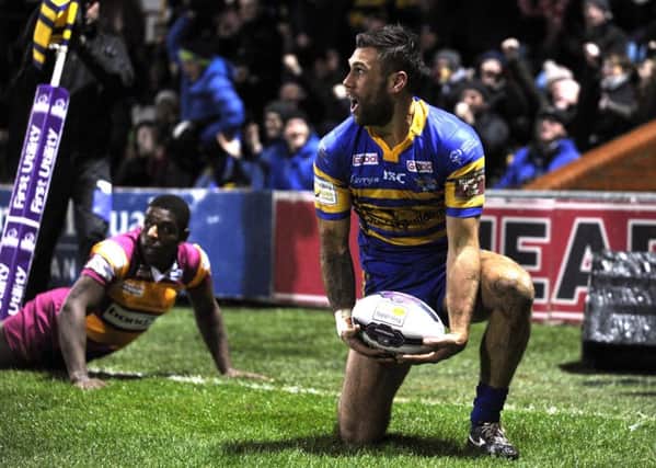 HOW'S THAT FOR STARTERS? Joel Moon scores the opening try for Leeds Rhinos against Huddersfield Giants. .  Picture: Bruce Rollinson