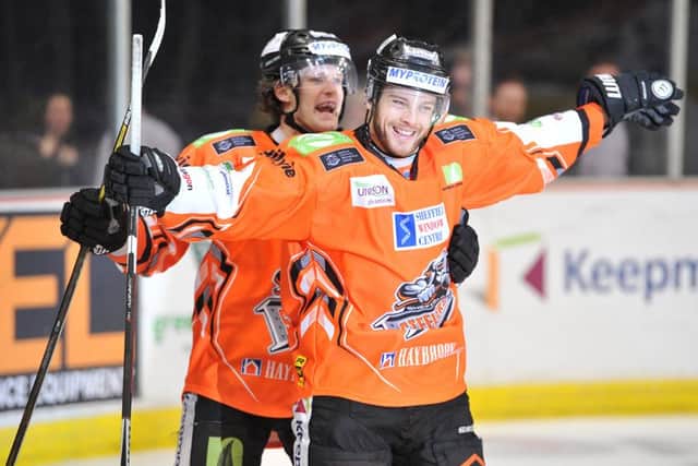 Returning Robert Dowd celebrates his goal with line mate Levi Nelson. Picture: Dean Woolley.