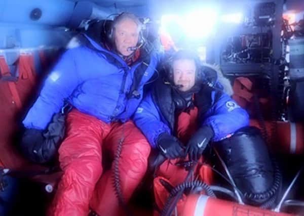 Photo issued by the US Coastguard of British adventurers Neil Laughton (left) and James Bingham, who have had to be rescued after becoming stranded off the coast of Alaska while kayaking across the Bering Strait.