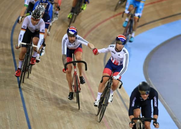 Great Britain's Sir Bradley Wiggins and Mark Cavendish slingshot each other during the men's Madison race.