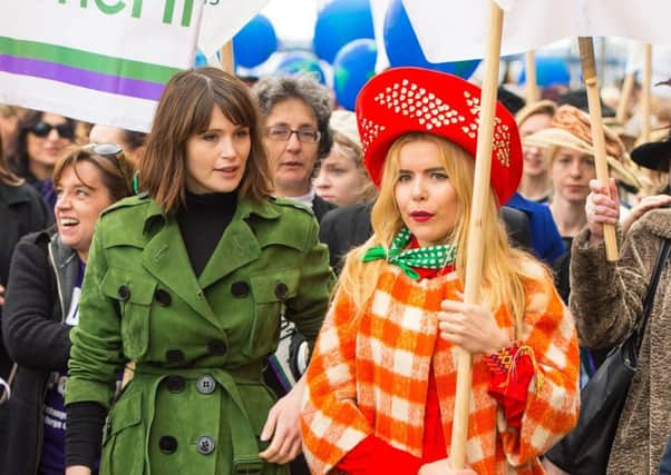 Gemma Arterton (left) and Paloma Faith take part in CARE International's Walk in Her Shoes march in central London, to mark International Women's Day last year. (PA).