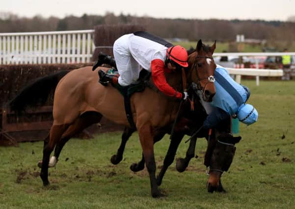 Victoria Pendleton, left, takes a tumble from Pacha Du Polder during the Betfair Switching Saddles Grassroots Fox Hunters Chase at Fakenham last month (Picture:: Nigel French/PA).