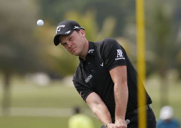 ON THE RISE: Danny Willett hits to the fourth green during the Cadillac Championship golf tournament in Doral. Picture: AP/Wilfredo Lee.