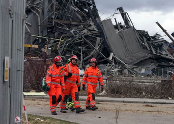 Rescue workers at the scene of the Didcot power station explosion