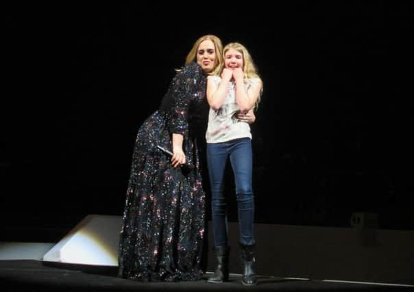 York music fan Kate Judson on stage with Adele in Manchester on Monday. Picture: Sue Judson