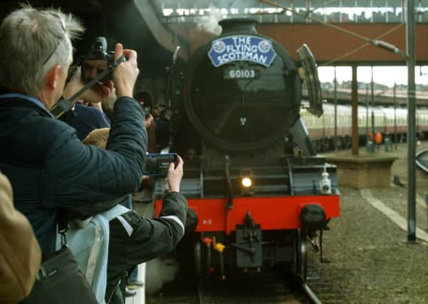 Steam enthusiasts taking photos of   the Flying Scotsman as it arrived in York last month. Picture: Gary Longbottom