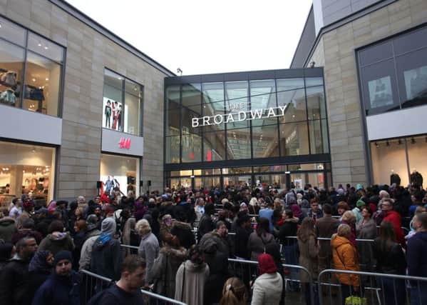 People queue outside the Broadway shopping centre in Bradford, for is grand opening.