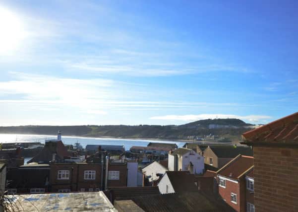 East Sandgate in Scarborough's old town has period features, a balcony with views over the bay and a four car garage