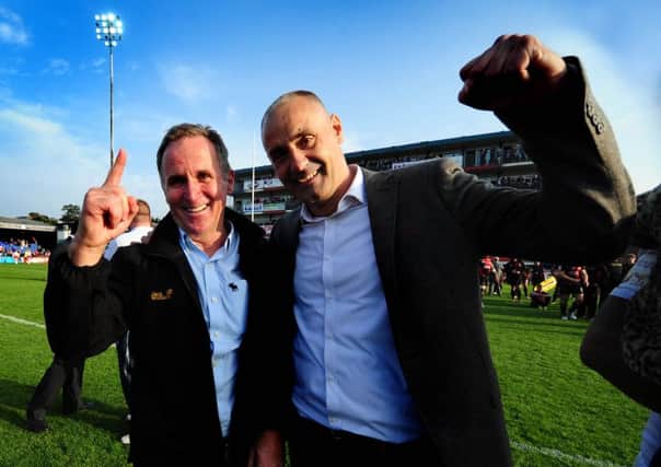 Brian Smith, left with chairman Michael Carter, seen celebrating Wakefield's 'Million Pound Game' victory against Bradford Bulls last year, securing their Super League status.