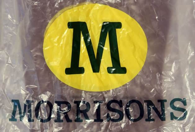 File photo dated 05/10/15 of a Morrisons plastic bag, as the supermarket posted an annual profit of Â£242 million, down from Â£345 million a year ago after closing a number of stores. PRESS ASSOCIATION Photo. Issue date: Thursday March 10, 2016. See PA story CITY Morrisons. Photo credit should read: Chris Radburn/PA Wire