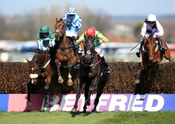 REPEAT SHOW: Trainer Colm Murphy hopes Sizing Granite can emulate his victory in the Doom Bar Maghull Novices Chase on Grand National Day at Aintree last year, seen above, when he lines up against favourite Un De Sceaux in Cheltenhams Queen Mother Champion Chase. Picture: Mike Egerton/PA.