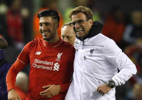 Liverpool manager Jurgen Klopp celebrates with Emre Can. Picture: Peter Byrne/PA.