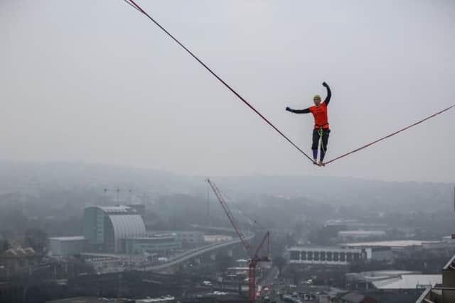 Sarah Rixham, 25, walks a high wire over the Sheffield skyline. Pictures: Ross Parry Agency/Simon Hulme