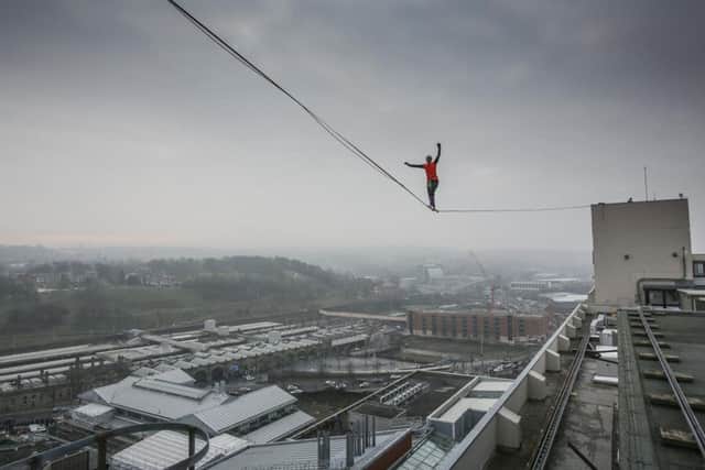 Sarah Rixham, 25, walks a highline over the Sheffield sky line. Picture: Tom Maddick.